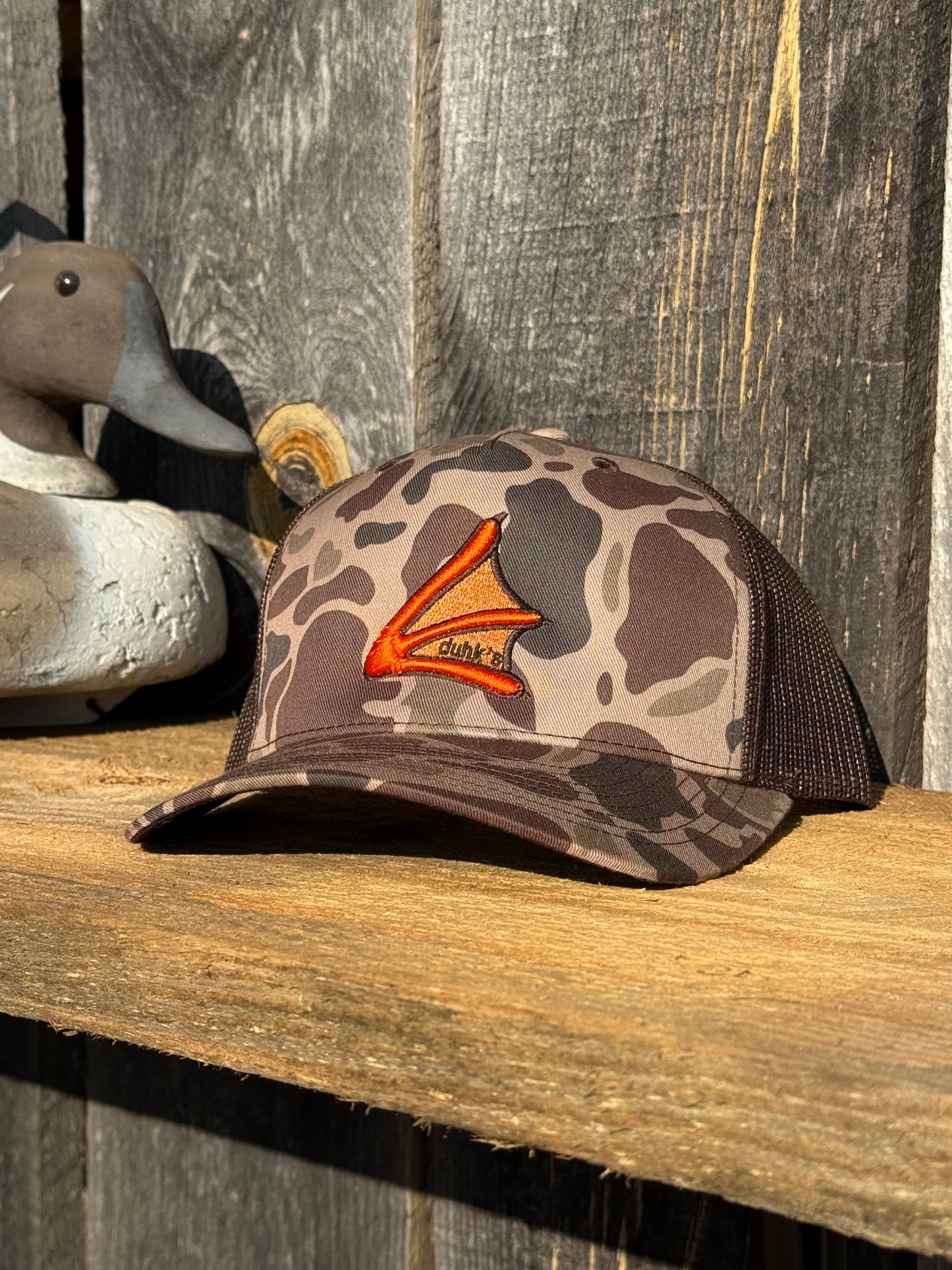 Bark duck camo duhk's foot logo. Mesh back