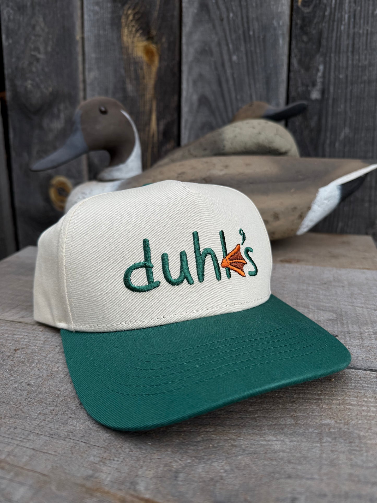 Embroidered duhk's logo hat. Cream/ Green