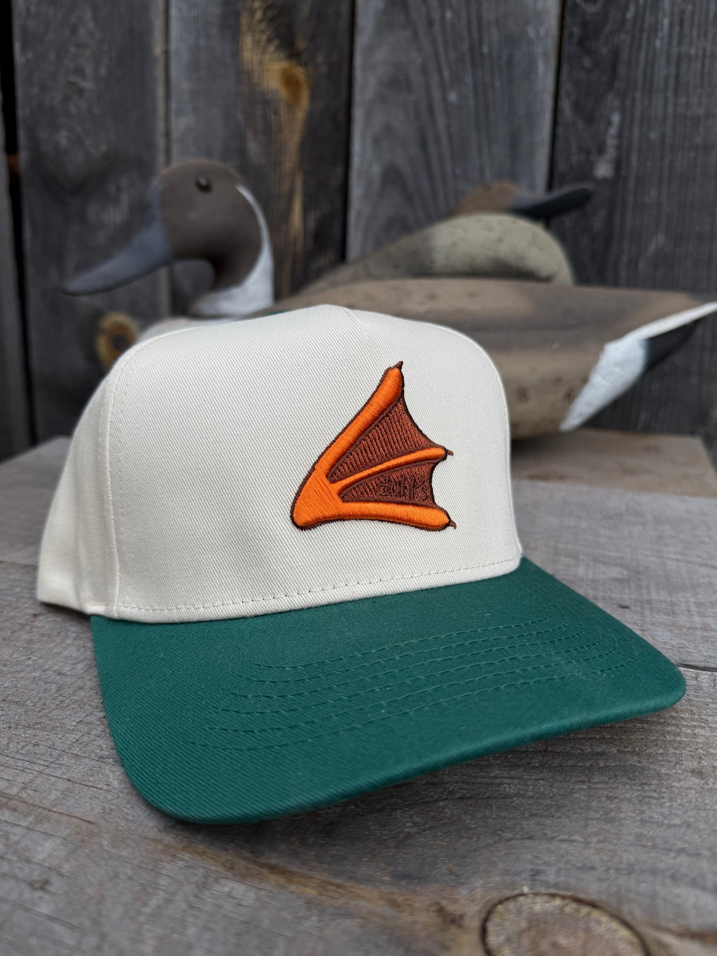 Embroidered duhk's foot hat. cream/green